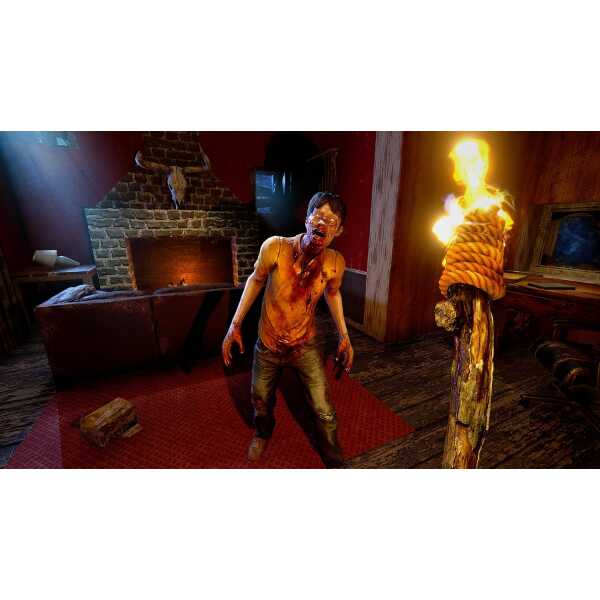 Scared person in a horror-themed room with fire and brick fireplace.
