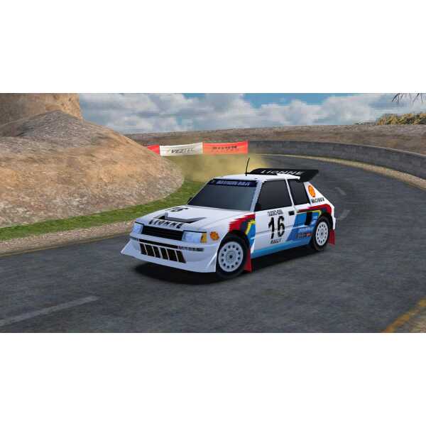 Classic rally car racing on a mountain road with sharp turns.