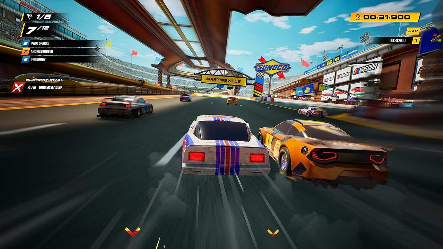 Racing game screenshot showing cars competing on a track with grandstands and colorful banners.
