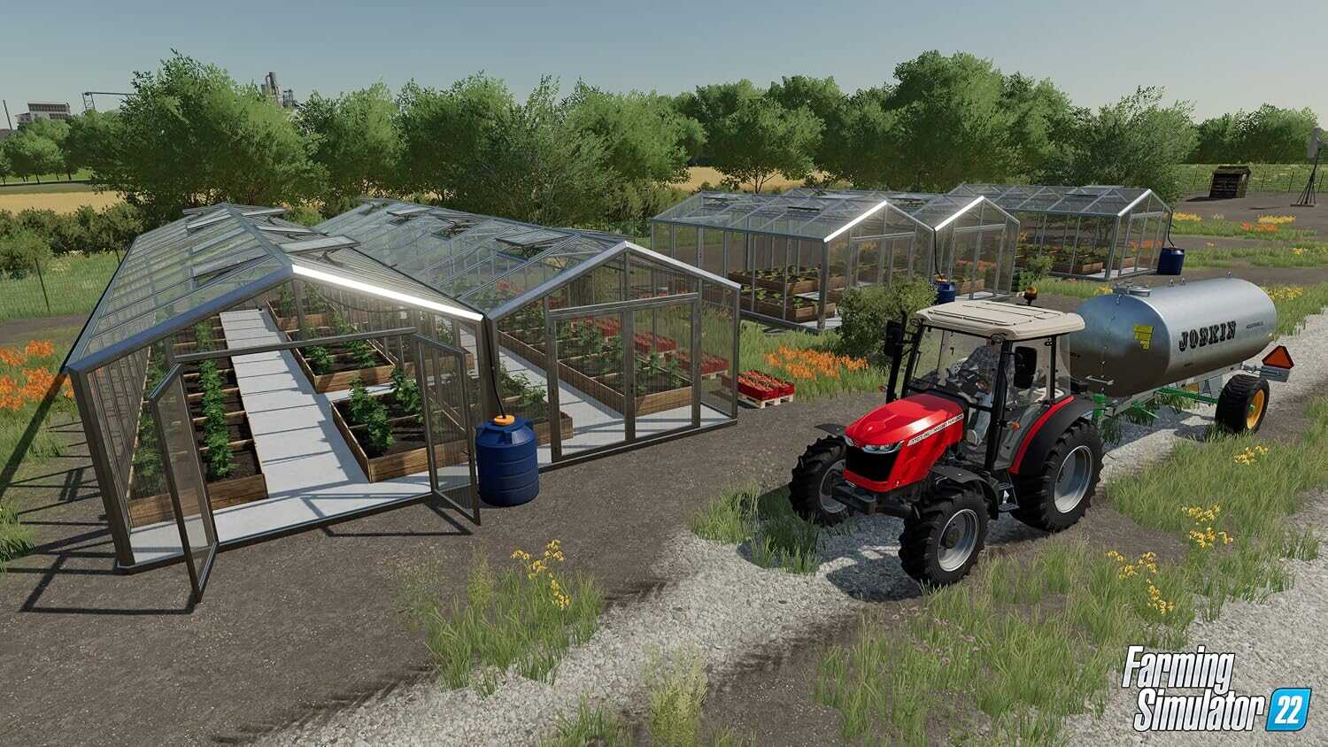 Greenhouse setup with tractor and water tank in Farming Simulator 22.