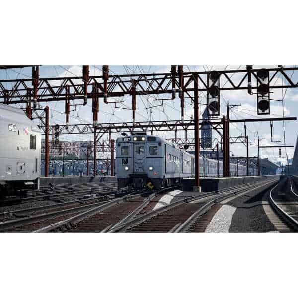 Realistic railway scene from Train Sim World 6 game with train and tracks.