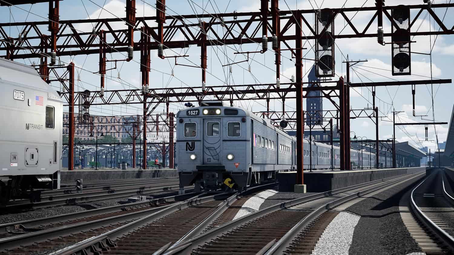 Realistic railway scene from Train Sim World 6 game with train and tracks.