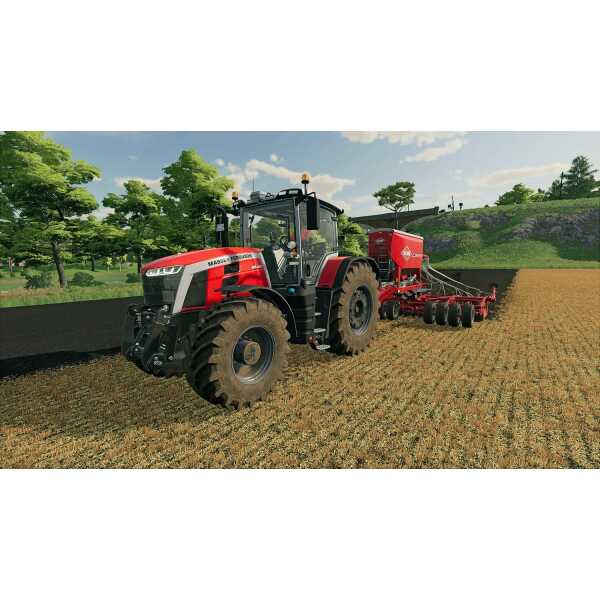 Red tractor with seeder attachment working on farmland in Farming Simulator 22.