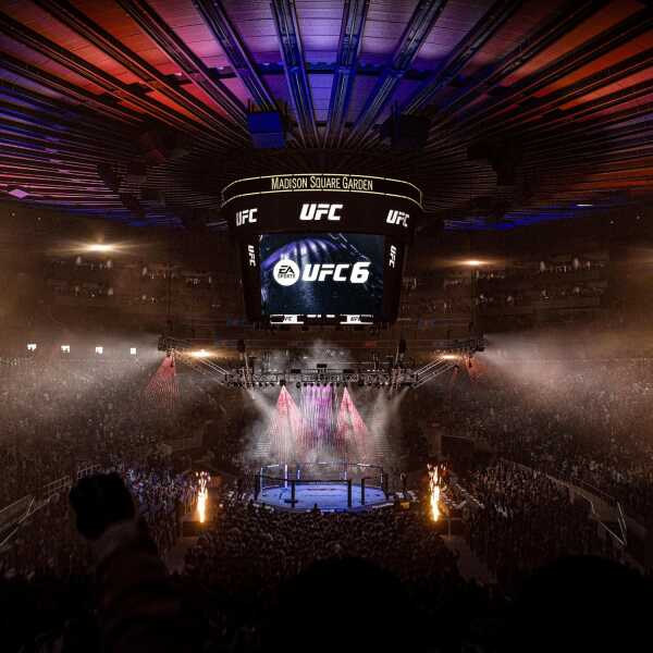 UFC 6 event at Madison Square Garden with vibrant lighting and packed audience.