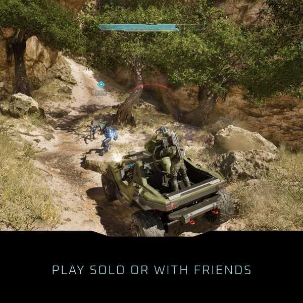 Gameplay scene from Halo: Campaign Evolved with vehicle and soldiers in rugged terrain.