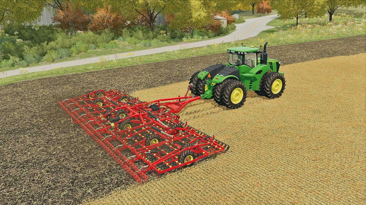 Green tractor with red cultivator working on farmland in Farming Simulator 22.