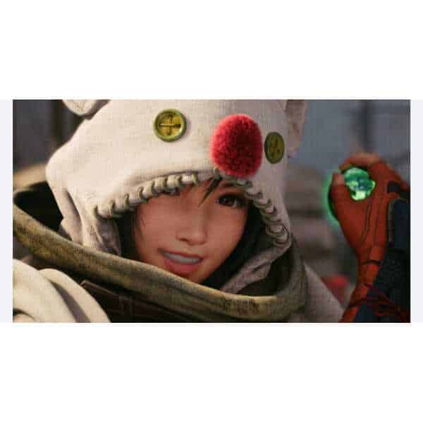 Woman in a cozy hoodie with a red pom-pom, holding a gaming device.