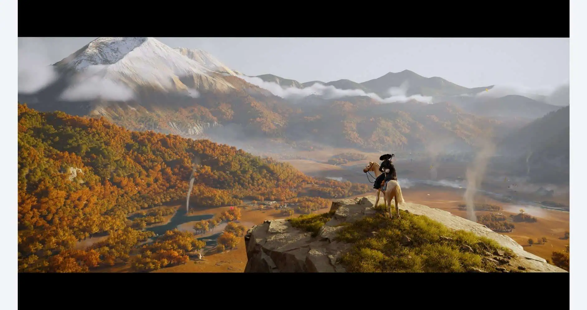 Scenic view of Yotei Mountain with autumn foliage and a hiker in the foreground.