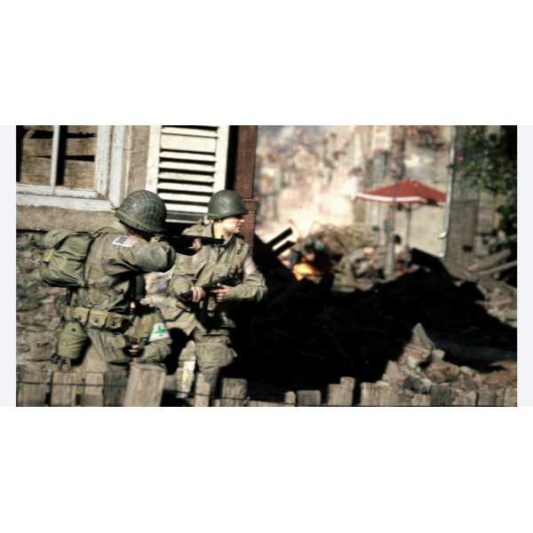 A soldier team in combat gear during a battlefield scene.