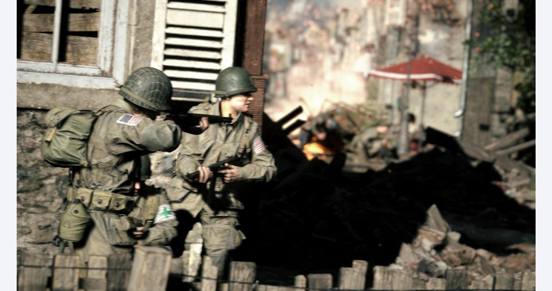 A soldier team in combat gear during a battlefield scene.