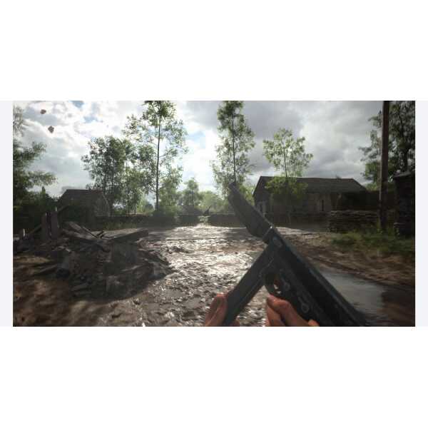 A soldier holding a gun in a war-torn rural landscape with damaged buildings and muddy terrain.