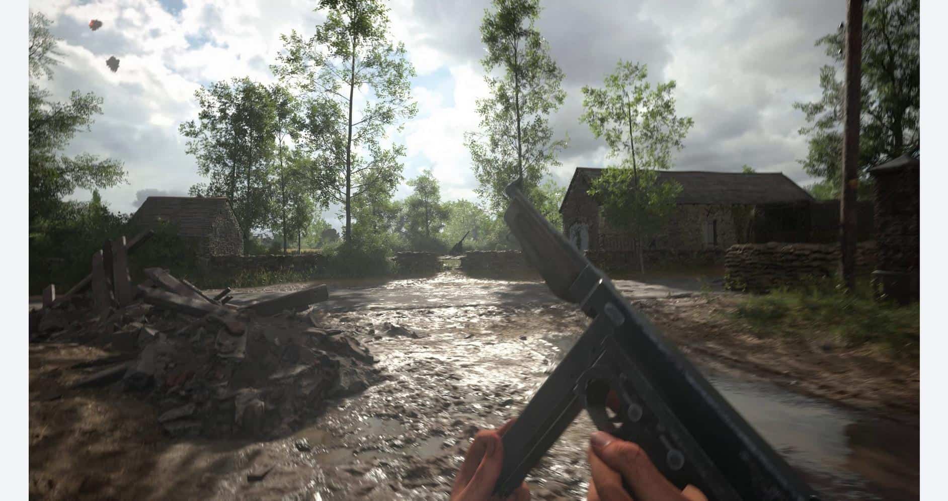 A soldier holding a gun in a war-torn rural landscape with damaged buildings and muddy terrain.