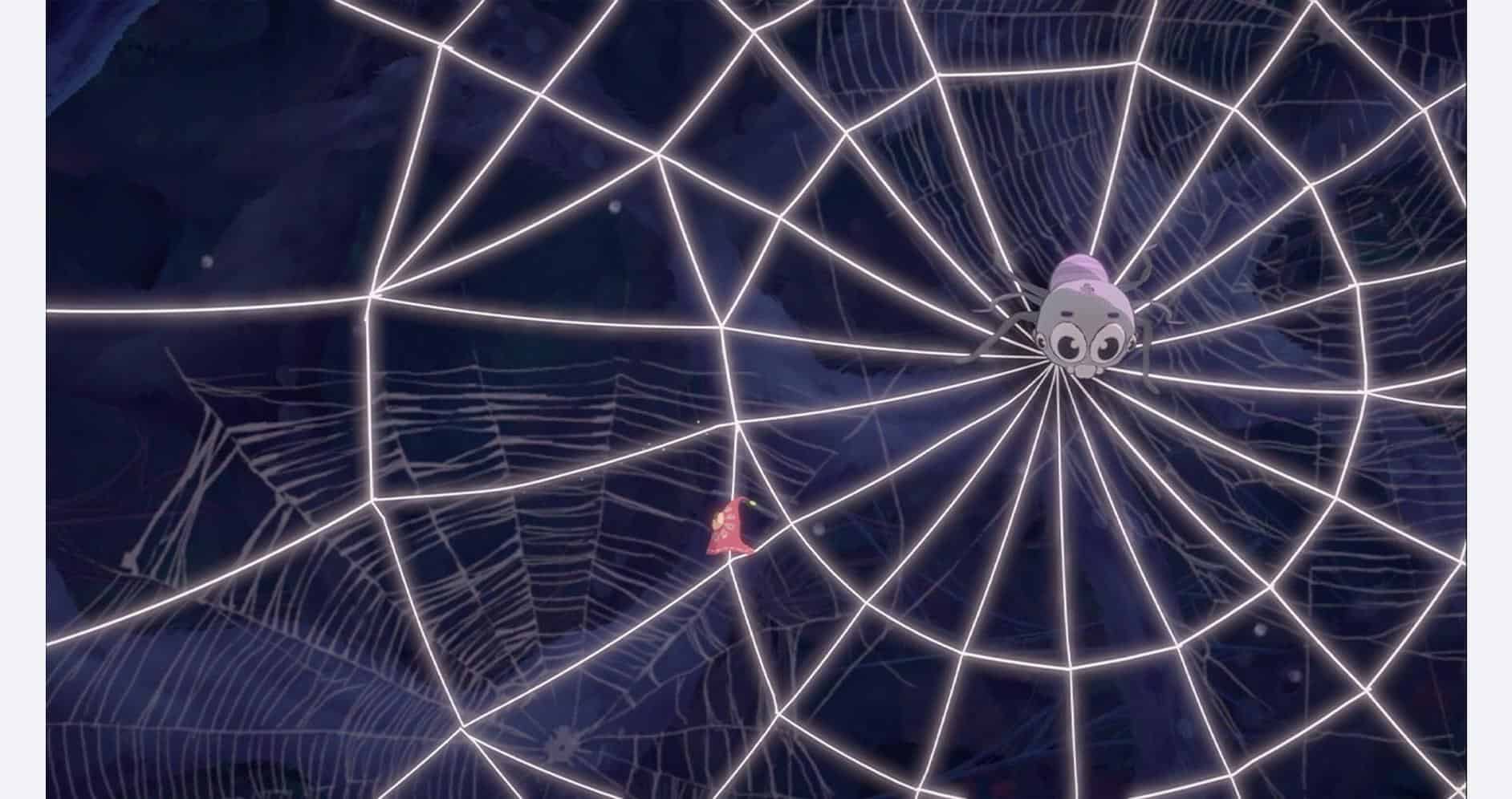 A spider web illuminated with neon lights, featuring a small cartoon skull in the center.