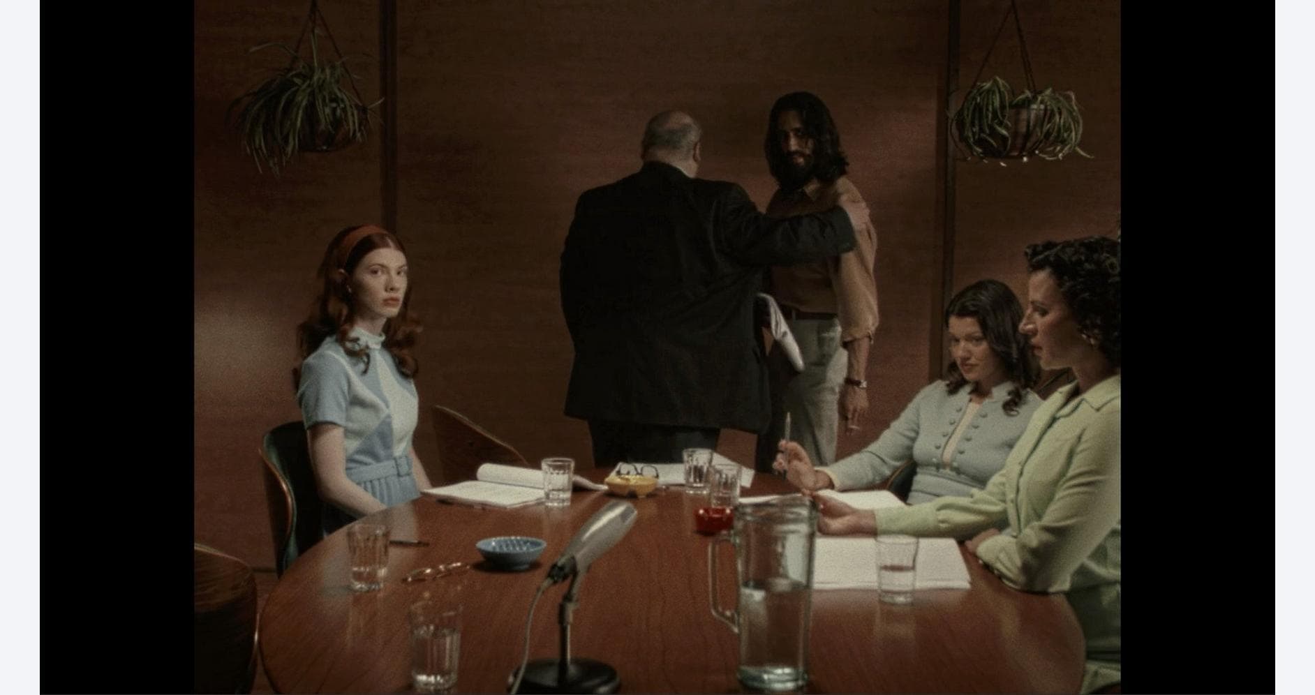 Business meeting discussing immortality project at Gameware.