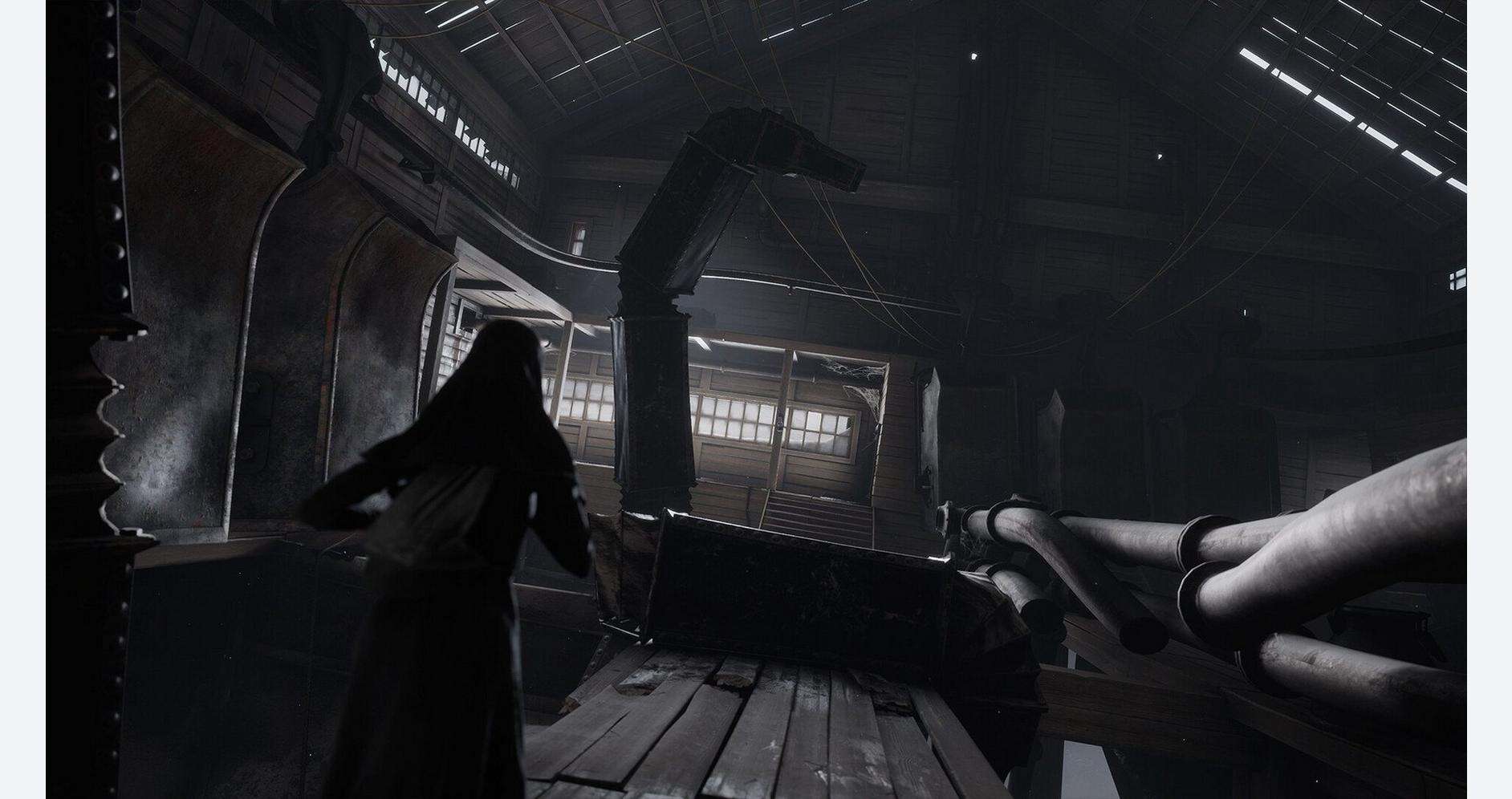 A woman in a dark industrial setting with machinery and metal structures.