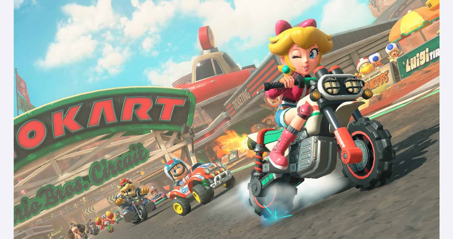 Mario Kart characters racing on a vibrant track with colorful scenery and cheering crowds.