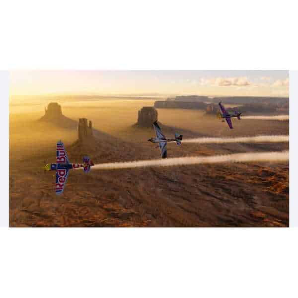 Red Bull Air Race over Monument Valley at sunset, showcasing flight simulation in Microsoft Flight S.