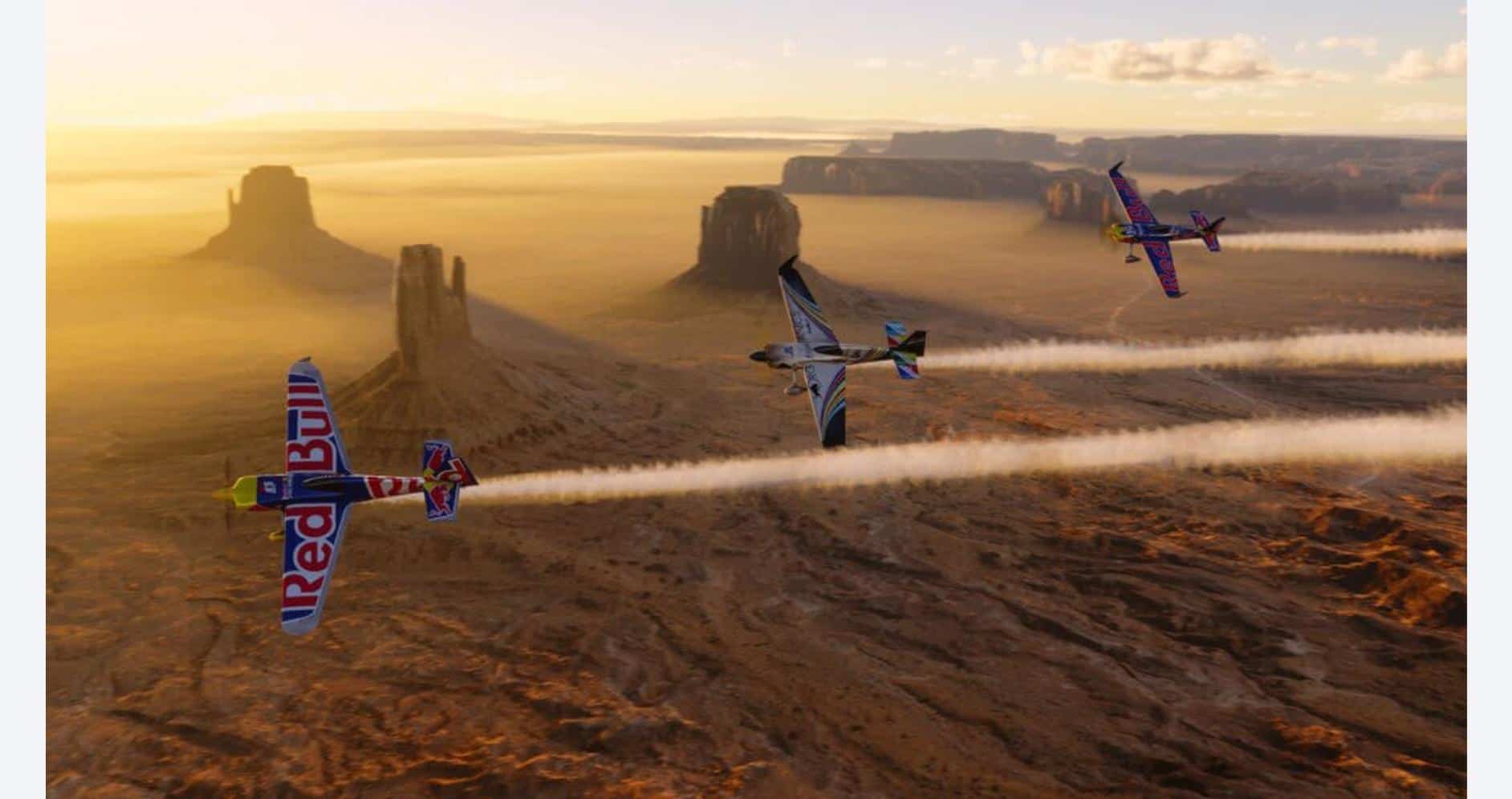 Red Bull Air Race over Monument Valley at sunset, showcasing flight simulation in Microsoft Flight S.