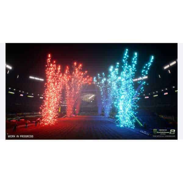 Fireworks explode in red and blue colors during Monster Energy Supercross event.