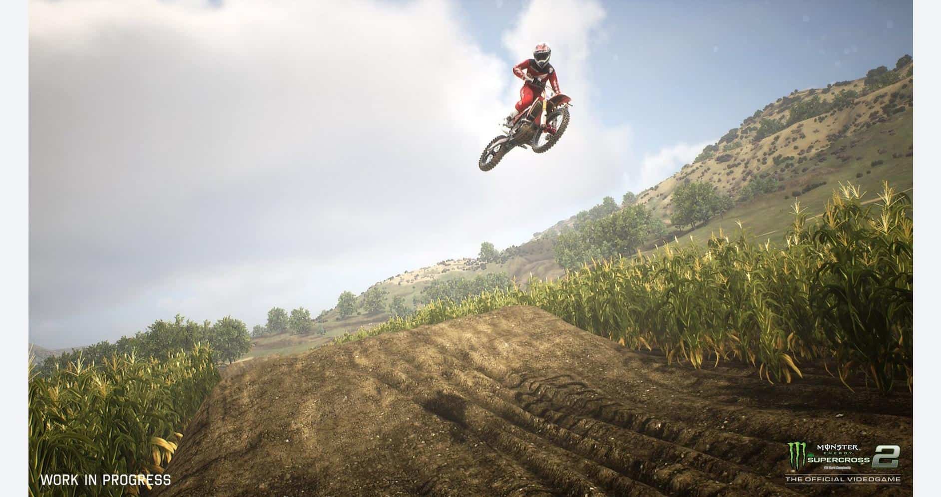 Motocross rider jumping over dirt track in Monster Energy Supercross game.