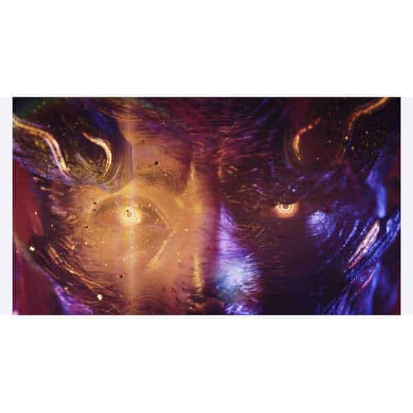 Futuristic digital face with glowing eyes and vibrant colors.