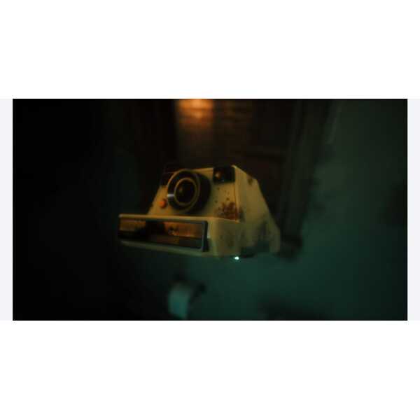 A vintage Polaroid camera with a worn, nostalgic look on a dark background.