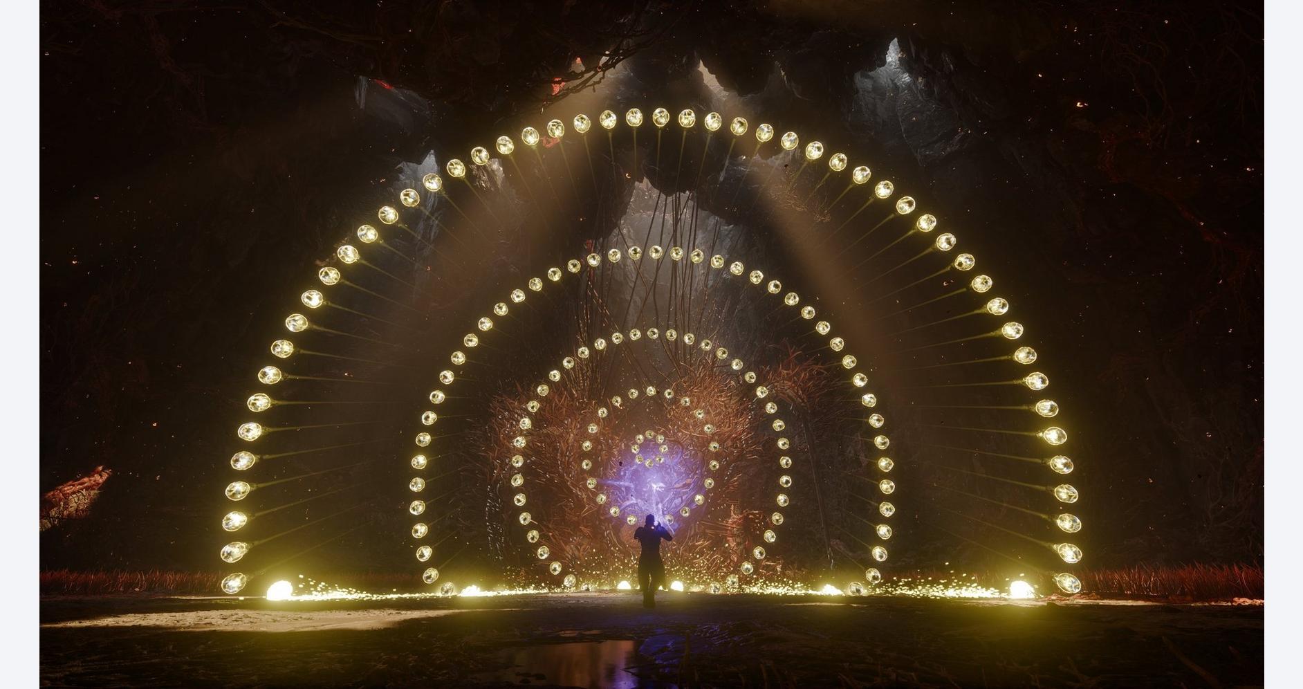 Light tunnel with circular LED displays at night.