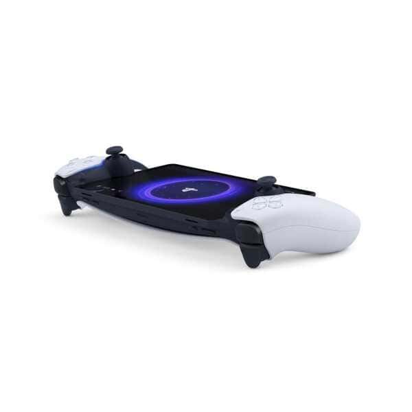 PlayStation gaming console with dual controllers and wireless charging pad.