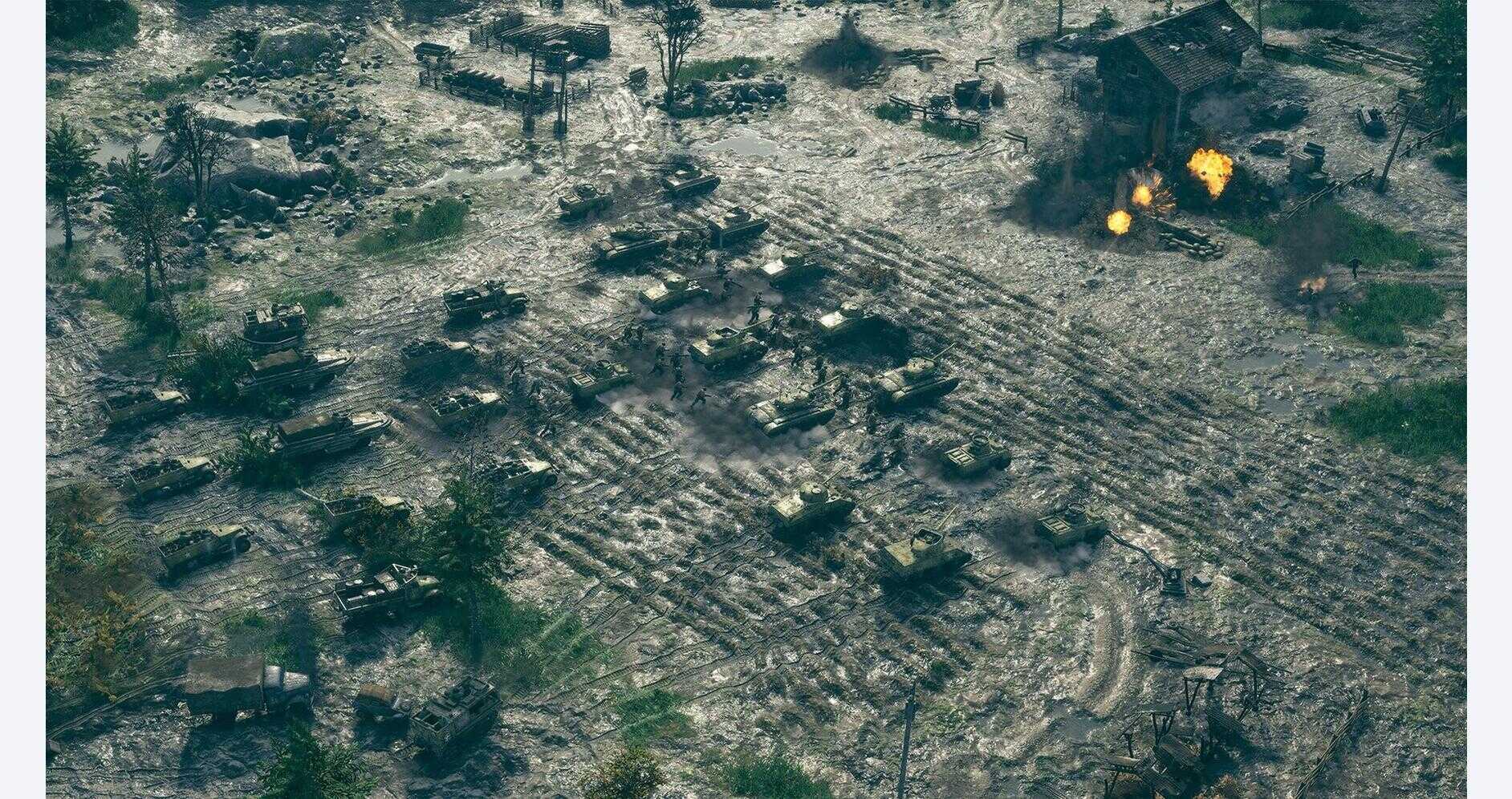 Military tanks and vehicles in a battlefield scene from Sudden Strike 5 - Deluxe Edition.