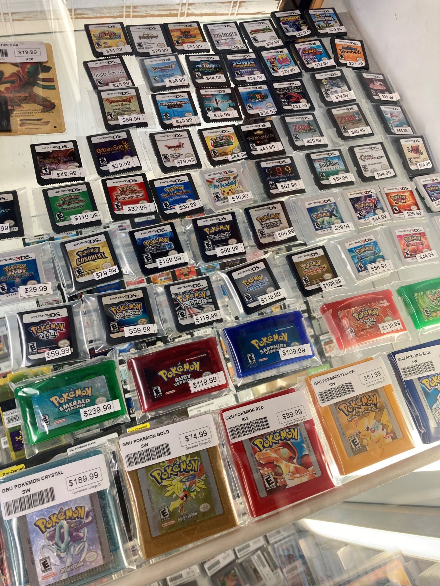 a selection of Pokemon games in a showcase