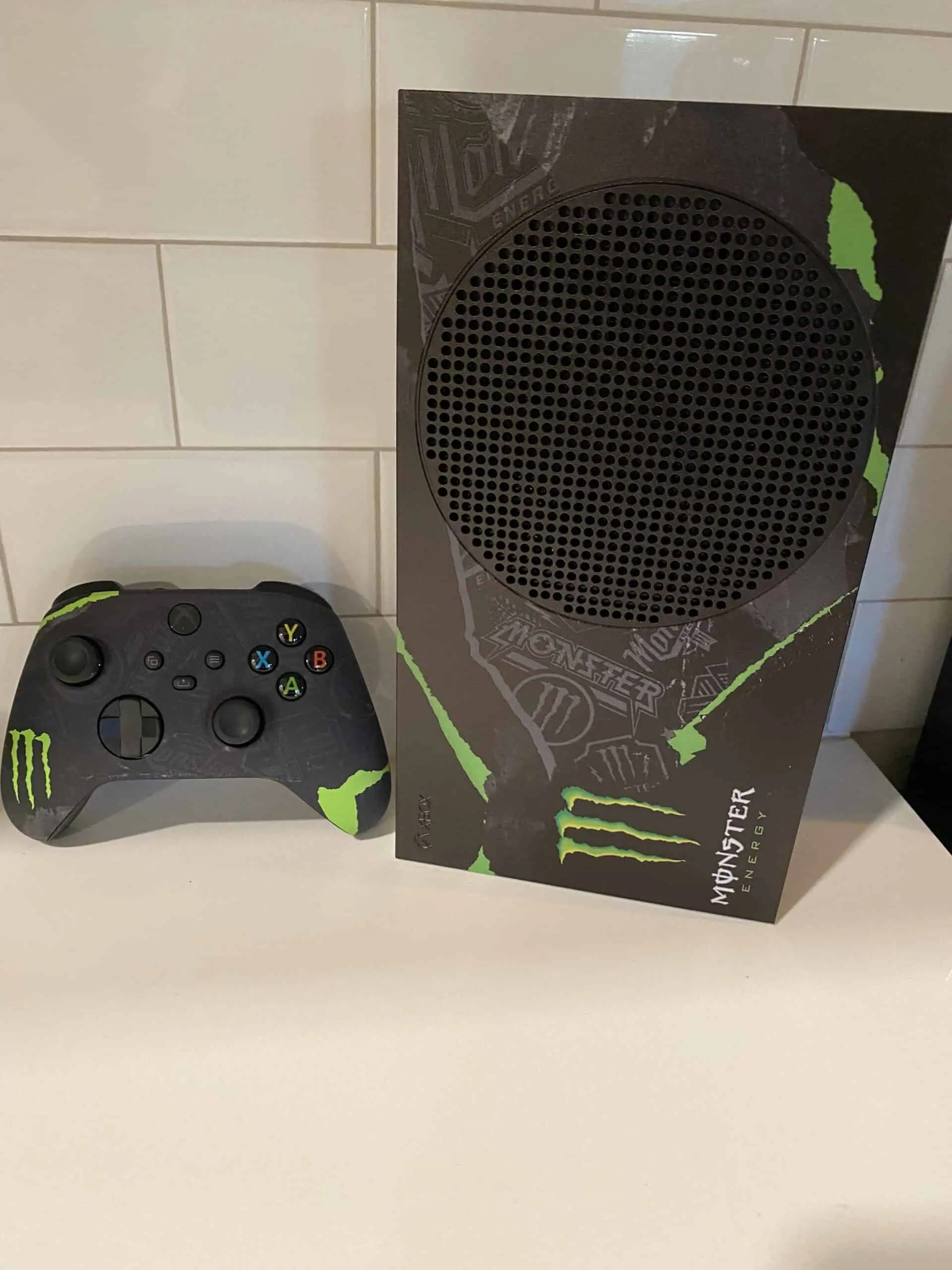 Xbox Series S Monster Energy Edition with controller on white surface.